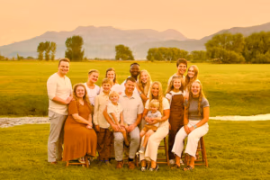 Group photo of Jared Rigby with family in a scenic outdoor setting, highlighting community and family values important for his sheriff campaign.