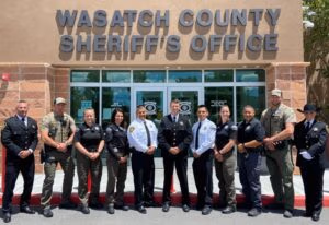 Wasatch County Sheriff's Office team members posing in front of the building, highlighting law enforcement commitment and community service.