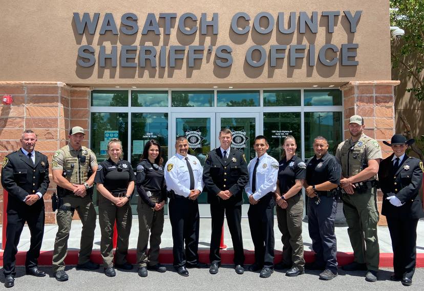 Group of Wasatch County Sheriff's Office deputies and officers in front of the Sheriff's Office building, emphasizing community safety and law enforcement presence in Wasatch County, Utah.